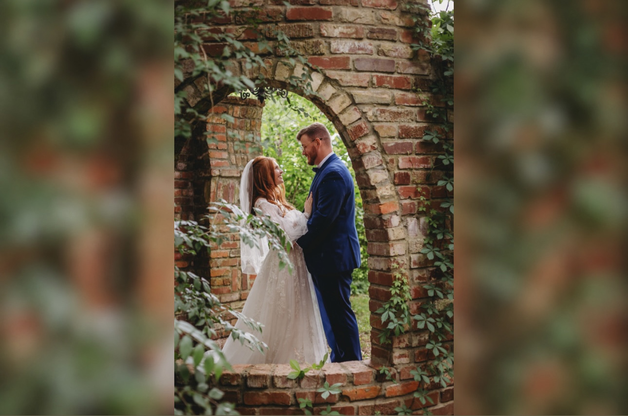 Bride photographed beside the Castle at Blue Spring Estate