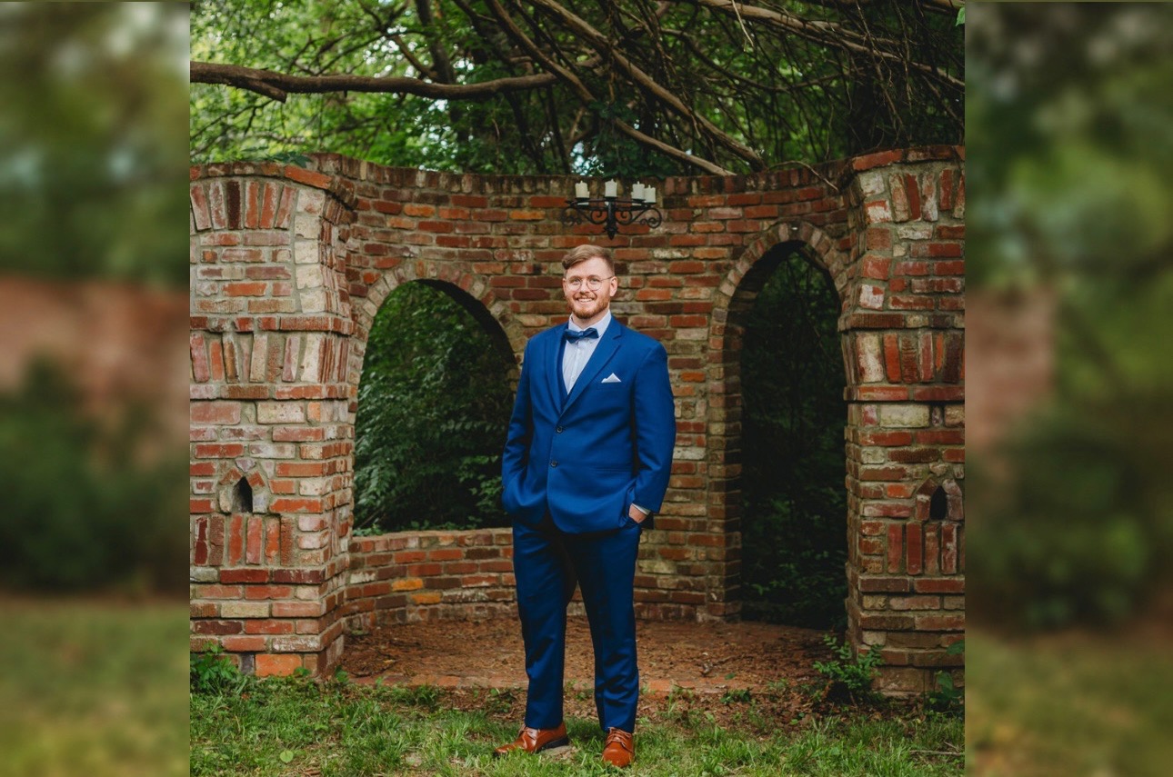 Groom photographed beside the Castle at Blue Spring Estate
